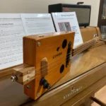 Side view of the whole body of the Cohiba cigar box guitar handcrafted by Bob.