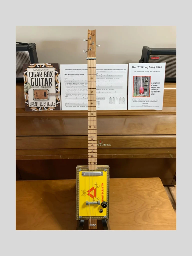 front vertical view of montecristo cigar box guitar by Bob's 3-Stringers