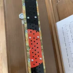 close up of the side view of the Romeo Y Julieta cigar box guitar