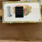 Front view of the Romeo Y Julieta cigar box guitar handcrafted by Bob.