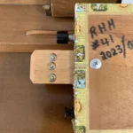 Close up of the bottom of the Romeo Y Julieta cigar box guitar