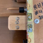 Close up of the bottom of the Romeo Y Julieta cigar box guitar