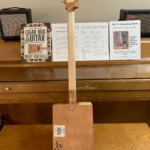 Back, vertical view of H_UPMANN cigar box guitar by Bob's 3-Stringers