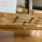 Front view of 3 string guitar with wooden headstock of Guantanamera Cigar Box Guitar