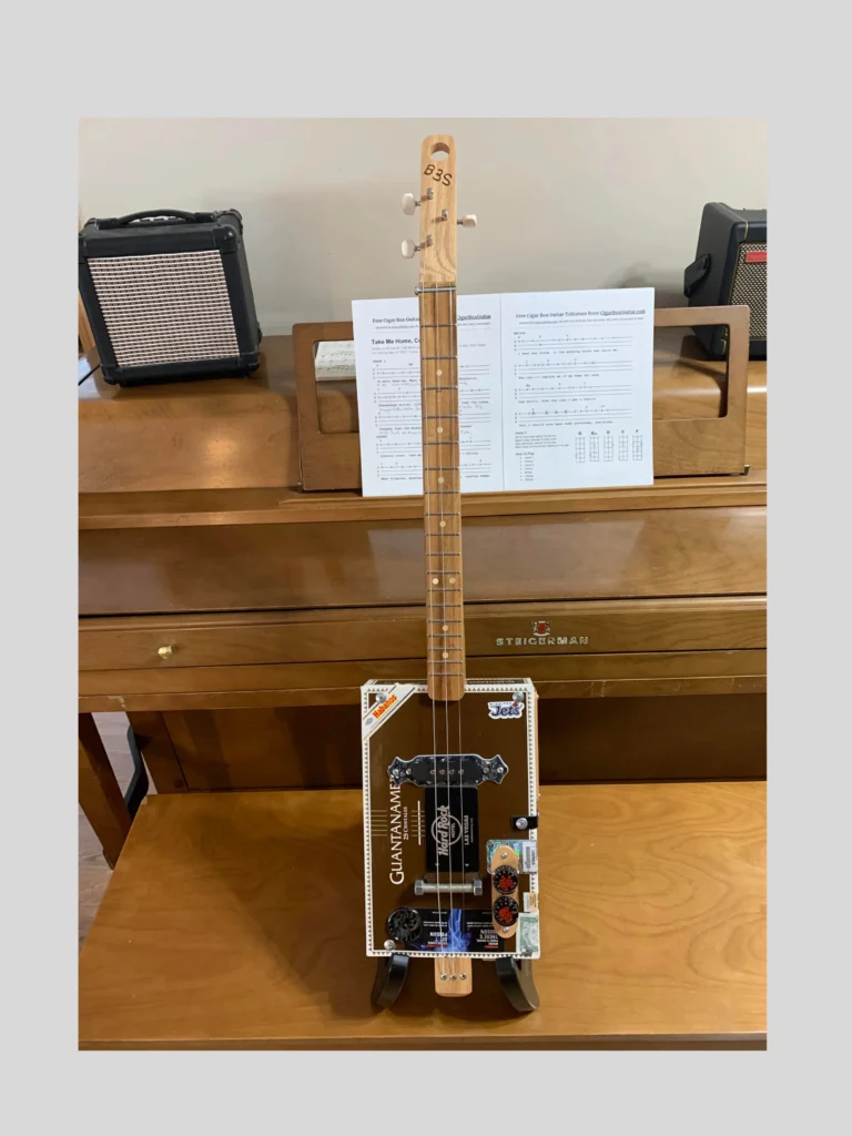 Johnny cash Guantanamera cigar box guitar vertical view of front