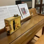Side view of the whole body of the Bances cigar box guitar handcrafted by Bob.