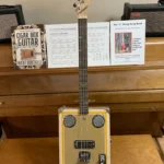 Front, vertical view of Craft/Stripped cigar box guitar by Bob's 3-Stringers