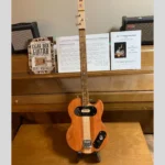 Front, vertical view of 2 Solid Body Guitar