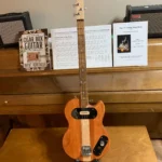 Front, vertical view of 2 Solid Body Guitar