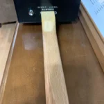 Back view of the bottom of the Fretless Bass guitar, where the Gloss finish on the neck attaches to the body.