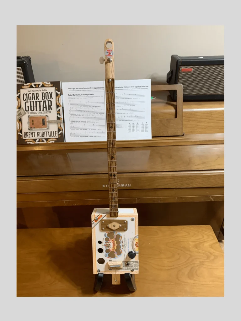 Front, vertical view of H Upmann Diddley Bow cigar box guitar by Bob's 3-Stringers
