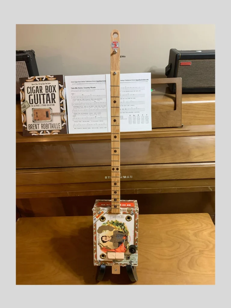 Front, vertical view of Bolivar Diddley Bow cigar box guitar by Bob's 3-Stringers