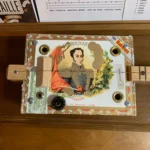 close up of the bottom of the Bolivar Diddley Bow cigar box guitar