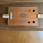 Front view of Alfred Dunhill Diddley Bow guitar where the neck attaches to the body