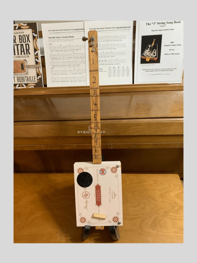 Front, vertical view of Grand Reserve Diddley Bow cigar box guitar by Bob's 3-Stringers