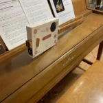 Side view of the whole body of the Grand Reserve Diddley Bow cigar box guitar handcrafted by Bob.