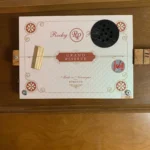 Front view of the Grand Reserve Diddley Bow cigar box guitar handcrafted by Bob.