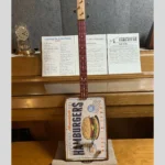 Front, vertical view of #62 Wild Raspberry Box Guitar by Bob's 3-Stringers