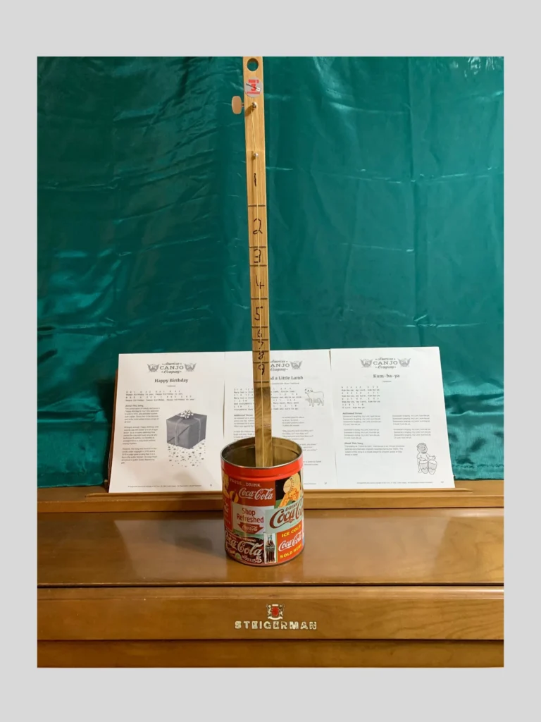 Front vertical view of the Coca Cola Canjo by Bob's 3-Stringers.