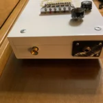 bottom part of a 6 String Guitar with a strap buttons, adjustable hard tail bridge, 6 steel wound string tuned EADGBE, Black volume and tone knobs, by Bob 3 stinger.