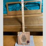 Front, vertical view of #66 diddley bow guitar by Bob's 3-Stringers