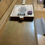 bottom part of a solid body guitar with a piezo pickup, 1/4" output jack, Fretted with adjustable screw nut, of #66 Diddley bow.
