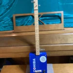 Front, vertical view of #8 Cohiba cigar box guitar by Bob's 3-Stringers