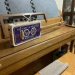Side view of the whole body of the 3 String License Plate Guitar handcrafted by Bob.