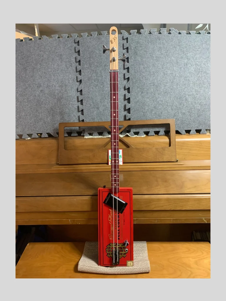 Front, vertical view of License Plate Guitar #71 Crowned Heads by Bob's 3-Stringers