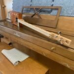 sideview of handmade Cohiba left-handed 3 string cigar box guitar